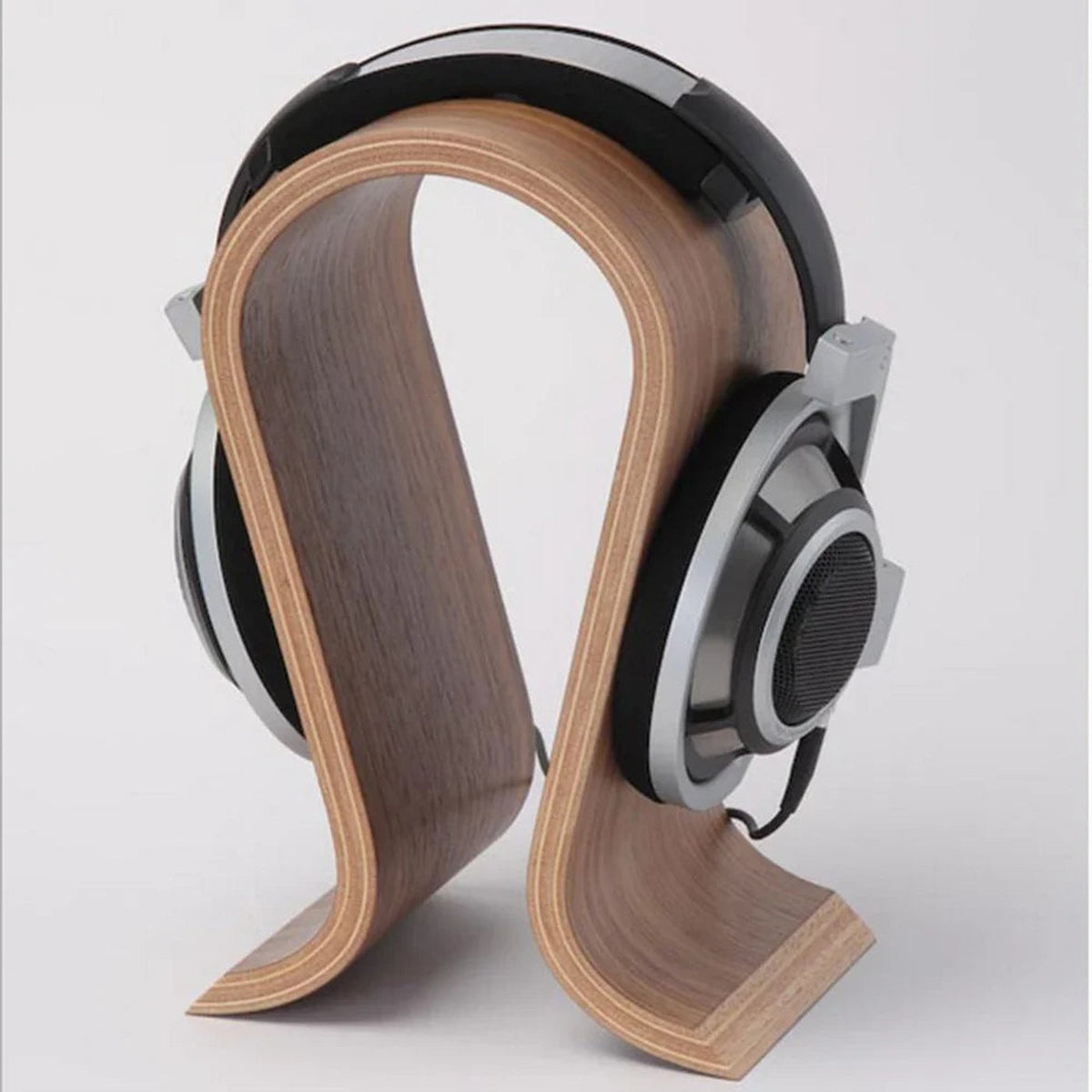 ARC holding over-ear headphones