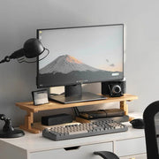 DECK bamboo monitor riser on a white desk