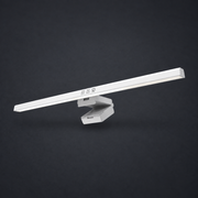 GLOW — Monitor Light Bar on graphite studio background; styled visualization