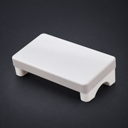 REST — Under-Desk Footrest on graphite studio background; styled visualization