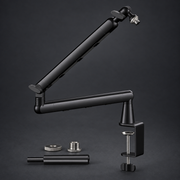 Black REACH microphone arm and accessories on graphite studio background; styled visualization with branding removed