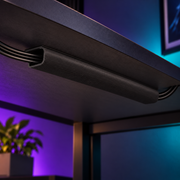 Black LANE cable channel mounted under a desk, hiding neatly routed cables