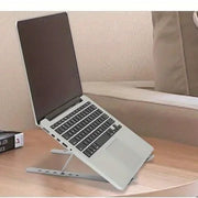 LIFT raising a laptop on a side table