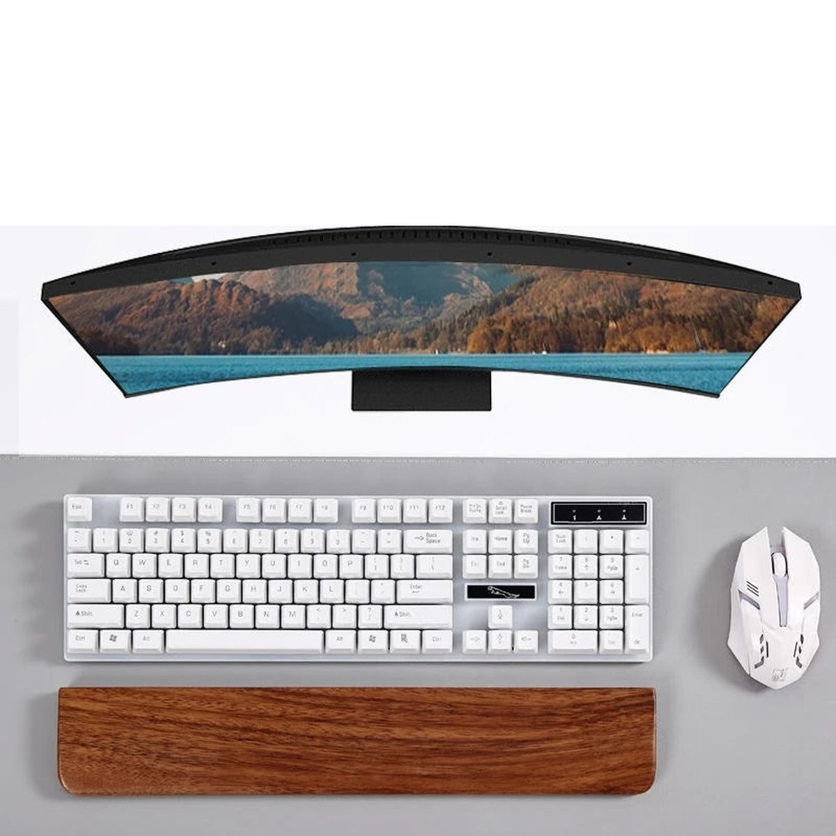 PALM walnut wrist rest in front of a white keyboard