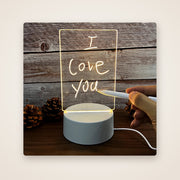 GLOWNOTE acrylic board with a handwritten glowing note
