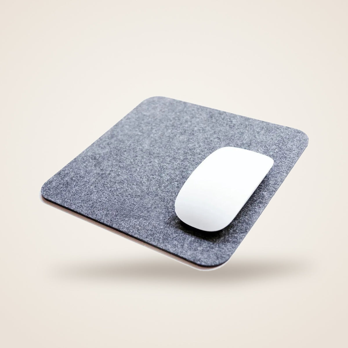 TILE felt mouse pad in grey with a mouse on it